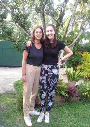 two women posing for a picture in a garden at Mama's Hostel by Taprobane in Negombo