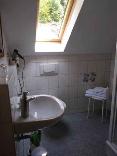 a bathroom with a sink and a window at Ferienwohnungen Wilhelm in Bad Schandau