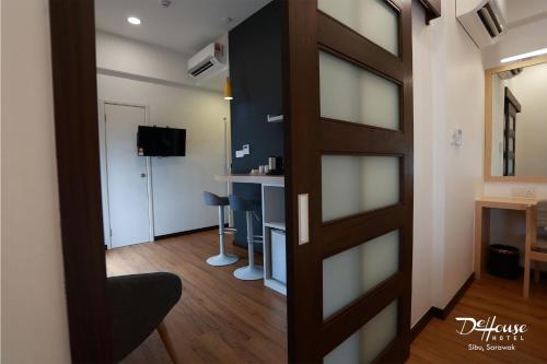 TV a/nebo společenská místnost v ubytování De House Hotel
