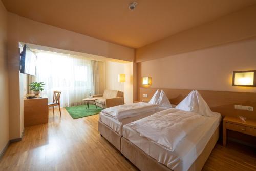 Ein Bett oder Betten in einem Zimmer der Unterkunft Hotel-Restaurant Allmer