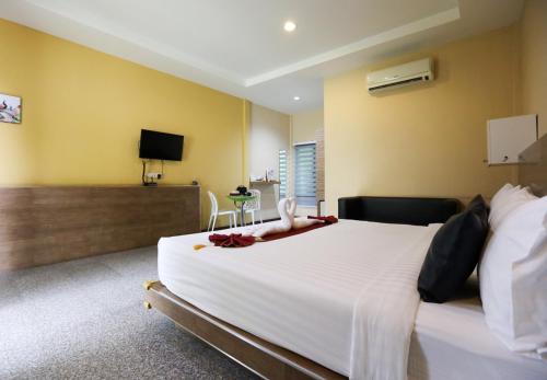 Postel nebo postele na pokoji v ubytování Jintana Resort