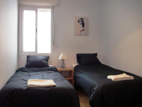 two beds sitting next to each other in a bedroom at Ayamonte Mirador in Ayamonte