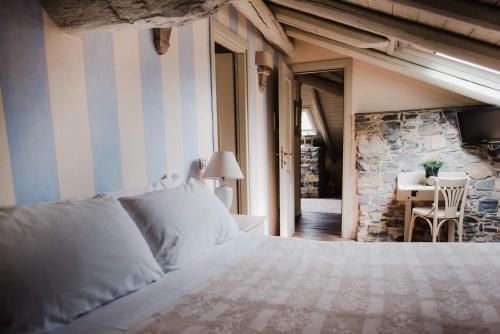 Postel nebo postele na pokoji v ubytování Regina Teodolinda Suites