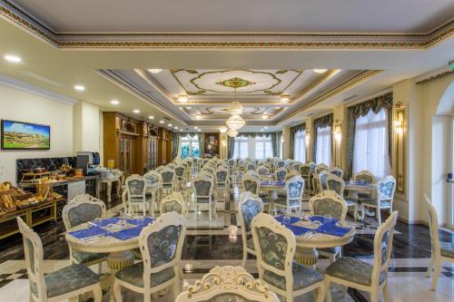 a conference room with a long table and chairs at Wellness Santa Hotel - adults plus12 in Agia Triada