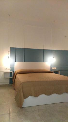 Llit o llits en una habitació de P-Apartment