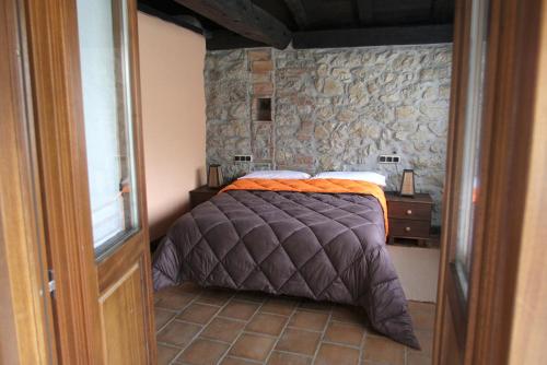 Postel nebo postele na pokoji v ubytování Hotel Rural Llerau
