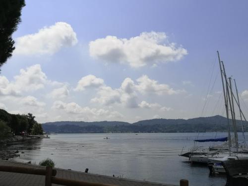a sail boat docked at a dock on a lake at Slowliday in Viverone