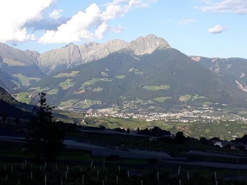a view of a mountain range with a town at GRETL - Residence in Parcines