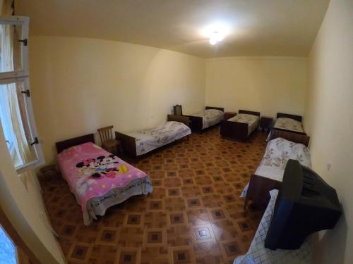Postel nebo postele na pokoji v ubytování NNN Guest House