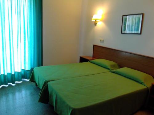 Postel nebo postele na pokoji v ubytování Hotel Simeon