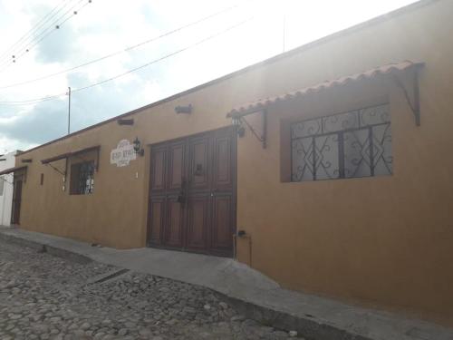 a building with two doors on the side of it at Posada Las Reynas in Mineral de Pozos