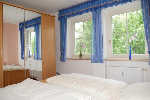 Postel nebo postele na pokoji v ubytování 2-Zimmer Deluxe Apartment Bad Füssing - Owner Suite