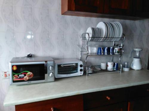 Kuchyň nebo kuchyňský kout v ubytování Jackson Guesthouse Anomabo