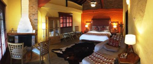Una cama o camas en una habitación de Monasterio San Agustín, Colombia