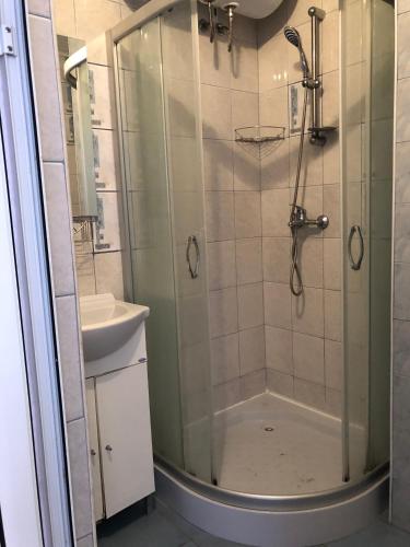 a bathroom with a shower and a sink at Dunav Str. in Ravda