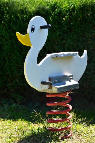 a plastic duck on top of a stack of baseball bats at Pension Pichler in Chienes