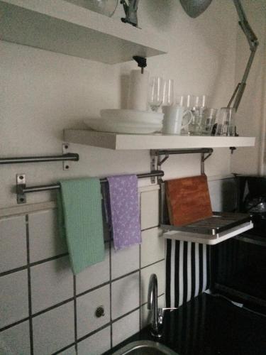 a kitchen with a sink and towels on a counter at Monoambiente in Buenos Aires