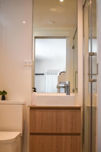 a bathroom with a sink and a mirror at Kabuki Mt Buller in Mount Buller