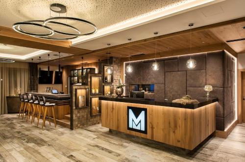 a large kitchen with a large counter top at Hotel Modern Mountain in Ischgl