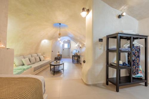 a living room with a couch and a table at Hidden Treasure Suites in Vóthon