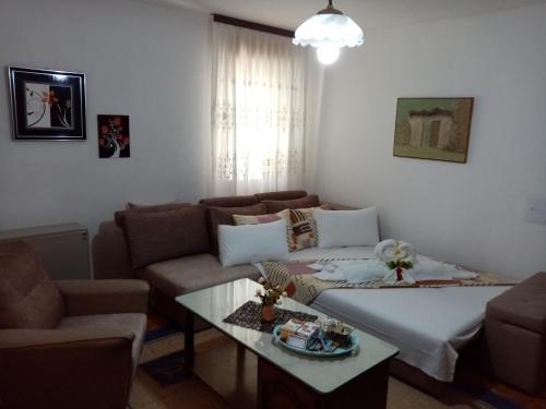 a living room with a couch and a table at Apartment Elmari in Prilep