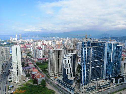 an aerial view of a city with tall buildings at ORBi CITY TOWERS in Batumi