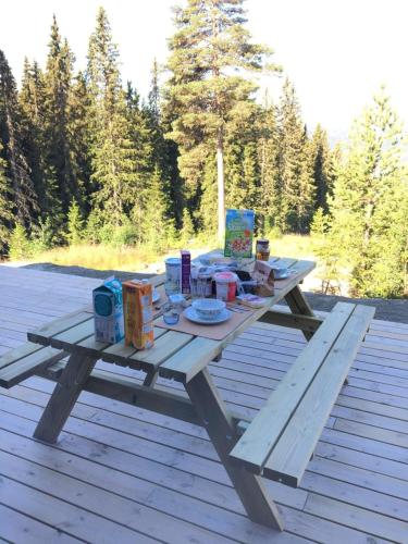 a picnic table with food and drinks on it at Lillebjørn in Trysil