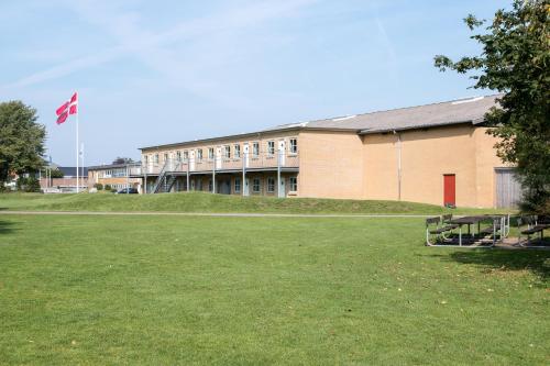 a building with a canadian flag in front of it at Pulzion - Sportshotel in Kolding