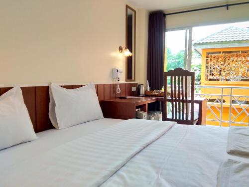 Кровать или кровати в номере Baan Wanchart