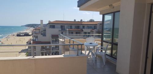 a balcony with a view of the beach at Apartment with Sea View in Obzor Beach in Obzor