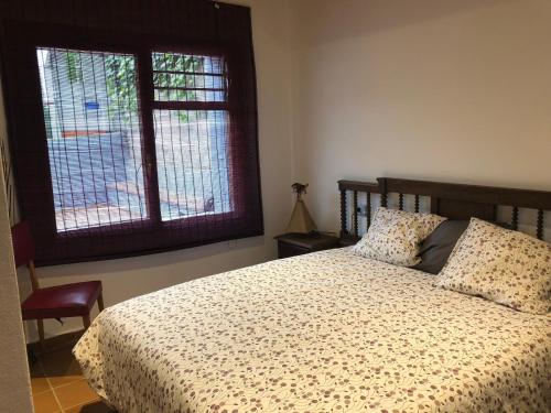 Кровать или кровати в номере Apartamento con terraza y chimenea