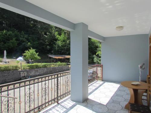 a balcony with a view of a garden at Hotel Germenji in Gërmenji