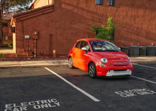 a small red car parked in a parking lot at Red Mountain Resort in St. George