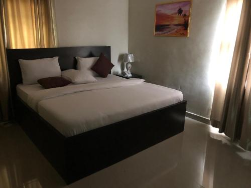 מיטה או מיטות בחדר ב-Choice Suites II