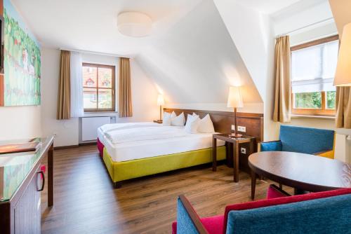 Ένα ή περισσότερα κρεβάτια σε δωμάτιο στο Boutique Hotel Bundschuh 3 Sterne Superior