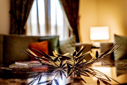 a table with a centerpiece on top of it at Vivienda Hotel Villas in Riyadh