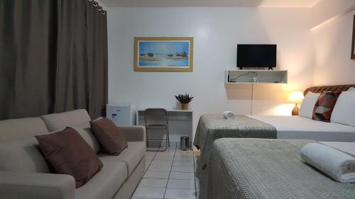 TV a/nebo společenská místnost v ubytování B & A Suites Inn Hotel - Quarto Luxo Palladium