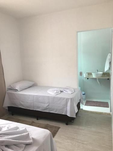 Ένα ή περισσότερα κρεβάτια σε δωμάτιο στο Pousada Anjos da Montanha