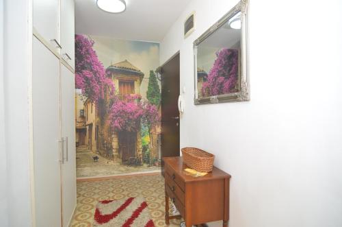 a hallway with a painting on the wall at Apartment NL in Sarajevo