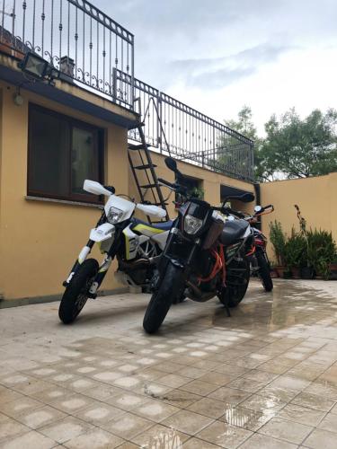 a motorcycle parked in front of a building at Domus Birdi in Orroli