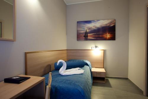 Postel nebo postele na pokoji v ubytování Motel Karibe