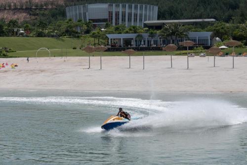 a jet ski in the water near a beach at HARRIS Resort Barelang Batam in Sagulung