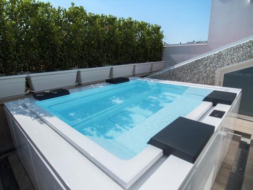 a swimming pool on the roof of a house at Opera Arte Rooms in Porto Recanati
