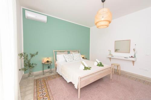 En eller flere senge i et værelse på Casa Martini Mondello