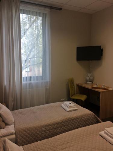Ένα ή περισσότερα κρεβάτια σε δωμάτιο στο 3Rooms