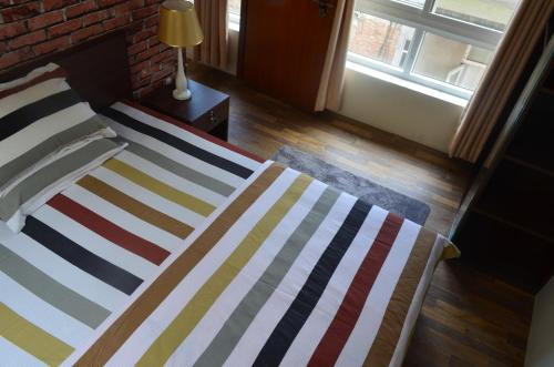 Postel nebo postele na pokoji v ubytování NhuChhe Apartments