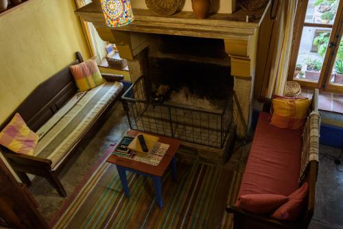 an overhead view of a living room with a fireplace at Casa Rural Caenia Grupos in Traguntia