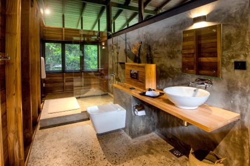 a bathroom with a sink and a toilet at Sati Villa Kandy Sri Lanka in Kandy