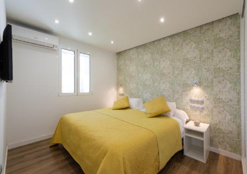 מיטה או מיטות בחדר ב-Sunset dream Suite - San Agustín