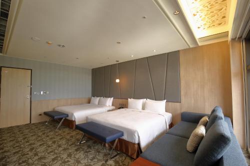 Säng eller sängar i ett rum på Kloud Hotel